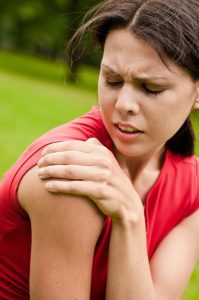 woman with joint pain needs a chiropractor